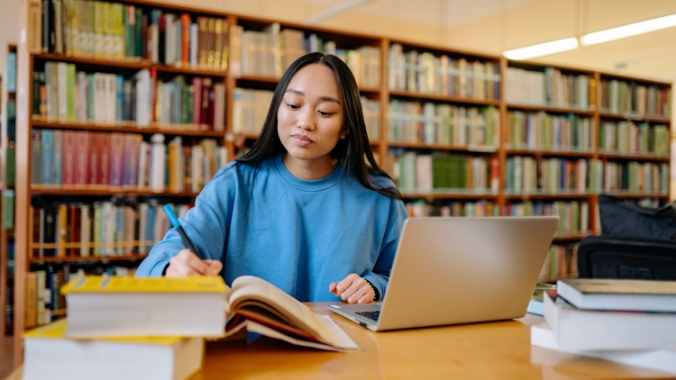 Woman studying in a library